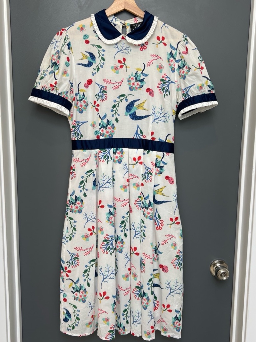 Vintage-Inspired White Floral Midi Dress with Navy Trim